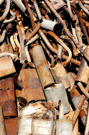 scrap yard pile of cars - old rusting exhaust systems piled up in a scrap yard Stock Photo - Budget Royalty-Free & Subscription, Code: 400-04981421