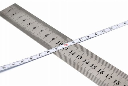 simsearch:400-06472161,k - White metal ruler and measuring tape on a white background Stock Photo - Budget Royalty-Free & Subscription, Code: 400-04981921