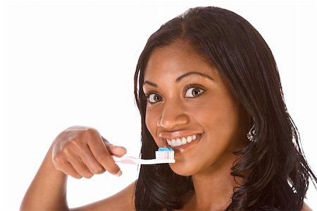 simsearch:400-06327889,k - Portrait of black woman holding toothbrush with blue toothpaste and smiling Photographie de stock - Aubaine LD & Abonnement, Code: 400-04982408