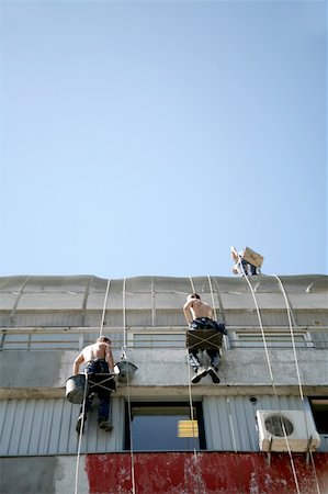 two construstion workers on side of house Photographie de stock - Aubaine LD & Abonnement, Code: 400-04983778