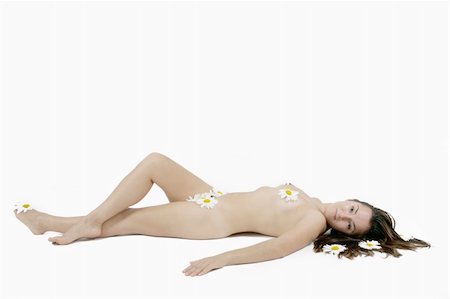 nude woman laying on white background with flowers Photographie de stock - Aubaine LD & Abonnement, Code: 400-04983820