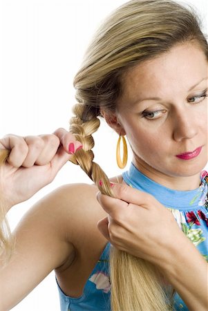 straight hair brushing - Long hair blonde woman braids one's hair Photographie de stock - Aubaine LD & Abonnement, Code: 400-04994461