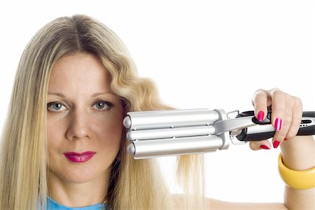 straight hair brushing - Long hair blonde woman with professional multi-styling set in her hand Photographie de stock - Aubaine LD & Abonnement, Code: 400-04994463