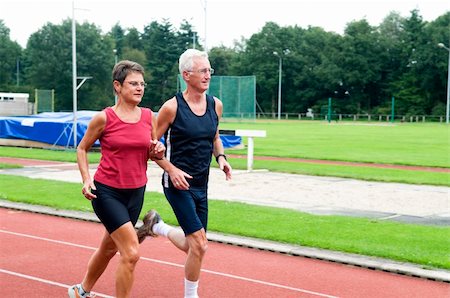 Two running pensioners having a healthy lifestyle. Fotografie stock - Microstock e Abbonamento, Codice: 400-04994684