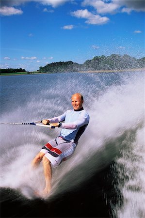 pulled - A young man water skiing Stock Photo - Budget Royalty-Free & Subscription, Code: 400-04995143