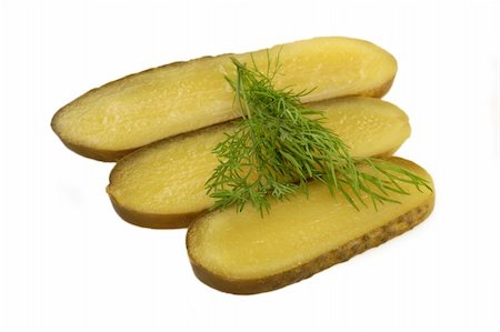 pickling gherkin - Three gherkin slices with fresh dill - isolated on white background Stock Photo - Budget Royalty-Free & Subscription, Code: 400-04995293