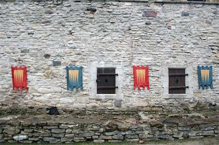 episcopal palace - Knightly flags on ancient walls of a castle Haapsalu Stock Photo - Budget Royalty-Free & Subscription, Code: 400-04995529