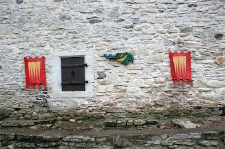 episcopal palace - Knightly flags on ancient walls of a castle Haapsalu Stock Photo - Budget Royalty-Free & Subscription, Code: 400-04995530