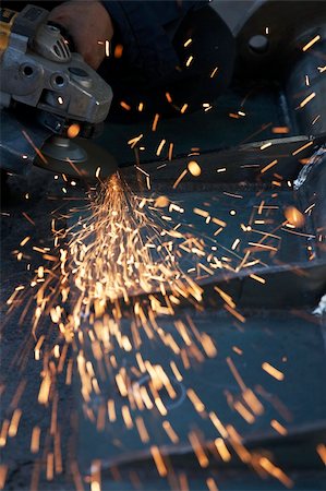 a picture of metal sparks coming from a grinder Stock Photo - Budget Royalty-Free & Subscription, Code: 400-04995826