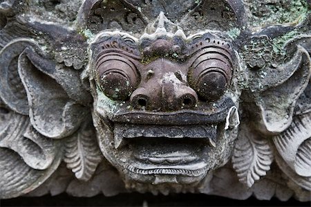 flower decoration in temple - Balinese temple sculpture is guarding the temple Stock Photo - Budget Royalty-Free & Subscription, Code: 400-04996199