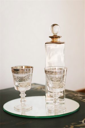 Antique glass bottle and glasses - home interiors. Stock Photo - Budget Royalty-Free & Subscription, Code: 400-04997204