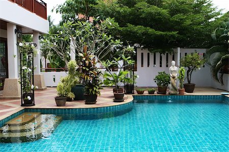 Mermaid statue next to a swimming pool. Stock Photo - Budget Royalty-Free & Subscription, Code: 400-04997202