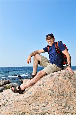 simsearch:400-04044871,k - Middle aged hiker sitting on a rock Photographie de stock - Aubaine LD & Abonnement, Code: 400-04997333