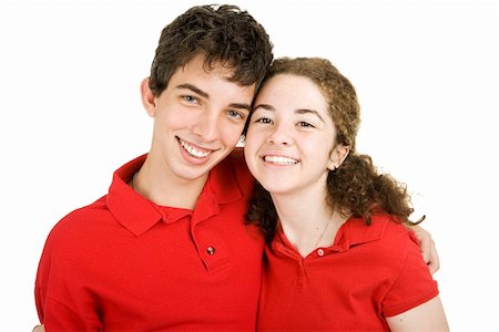 Portrait of an adorable teenaged couple isolated against a white background. Stock Photo - Budget Royalty-Free & Subscription, Code: 400-04997519