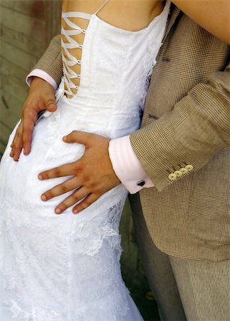 simsearch:400-04440941,k - The groom embraces the bride Fotografie stock - Microstock e Abbonamento, Codice: 400-04998090