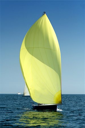 sailboat racing - Sailing yacht with spinnaker in the wind / beautiful image Stock Photo - Budget Royalty-Free & Subscription, Code: 400-04998309