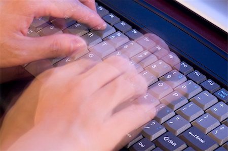 Person typing quickly on the keyboard of a computer with motion blur Stock Photo - Budget Royalty-Free & Subscription, Code: 400-04998322