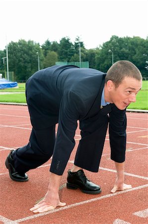 Businessman is ready for the start of his run. Stockbilder - Microstock & Abonnement, Bildnummer: 400-04998529