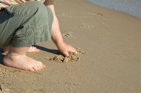 little girl on the beach. summertime, water and sand Stock Photo - Budget Royalty-Free & Subscription, Code: 400-04999086