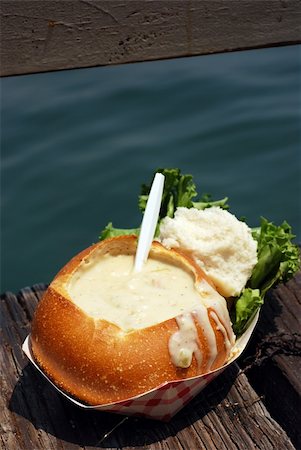 Clam chowder in a sourdough bread bowl on a wooden fishing dock Stock Photo - Budget Royalty-Free & Subscription, Code: 400-04999414