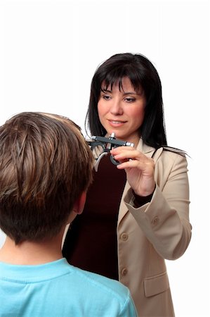 patient and doctor consultation diversity - A child getting a vision checkup at the optometrist Stock Photo - Budget Royalty-Free & Subscription, Code: 400-04999618