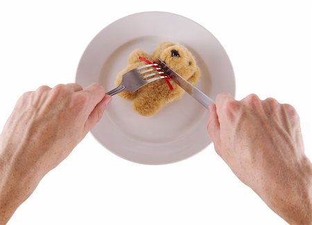 simsearch:693-03363711,k - Eating of a toy bear cub on a plate Stockbilder - Microstock & Abonnement, Bildnummer: 400-04999960
