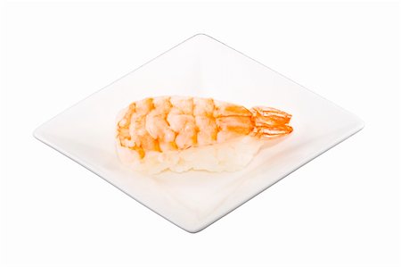 a square white plate with a piece of sushi Foto de stock - Royalty-Free Super Valor e Assinatura, Número: 400-04990076