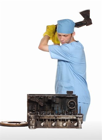 The person cuts with an axe the engine Stock Photo - Budget Royalty-Free & Subscription, Code: 400-04990084