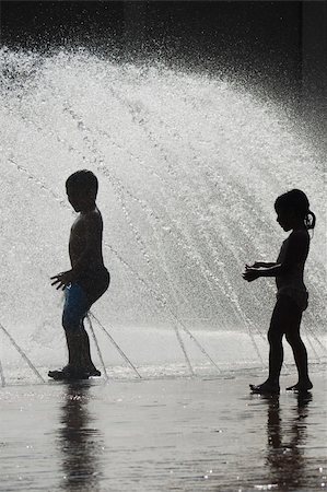 Children cooling off at a water fountain Stock Photo - Budget Royalty-Free & Subscription, Code: 400-04990091