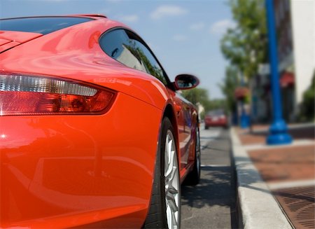 Red sports car at the curb Stock Photo - Budget Royalty-Free & Subscription, Code: 400-04990105