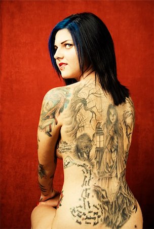 simsearch:400-05054627,k - Woman with many tattoos on her back and arms Stock Photo - Budget Royalty-Free & Subscription, Code: 400-04990402