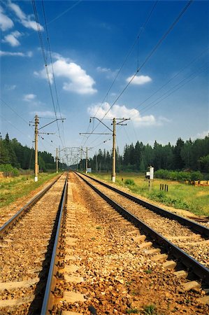 simsearch:400-05883568,k - Old Steel Railroad Tracks with reflection under bkue sky anf clouds Photographie de stock - Aubaine LD & Abonnement, Code: 400-04990909