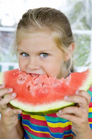 simsearch:400-06177351,k - Little blond girl with a piece of watermelon in her hands Stock Photo - Budget Royalty-Free & Subscription, Code: 400-04991007