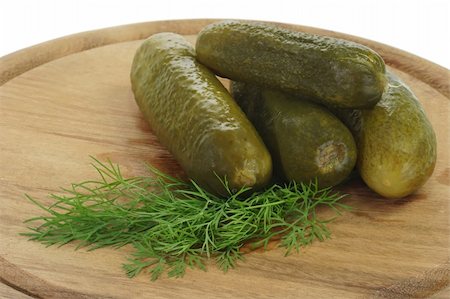 pickling gherkin - Pickled cucumbers with dill on a wooden kitchen board Stock Photo - Budget Royalty-Free & Subscription, Code: 400-04991112