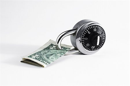 simsearch:400-04238099,k - Dollar bill locked by combination lock on white background. Stock Photo - Budget Royalty-Free & Subscription, Code: 400-04991457