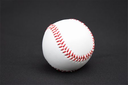 simsearch:400-04673387,k - On a black background a baseball ball Photographie de stock - Aubaine LD & Abonnement, Code: 400-04992058