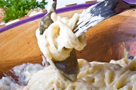 close up of alfredo noodles with a spoon and fork Photographie de stock - Aubaine LD & Abonnement, Code: 400-04992730