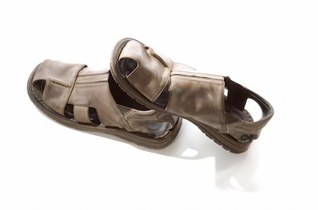Old sandals with shadow on white backgeround Foto de stock - Super Valor sin royalties y Suscripción, Código: 400-04992857