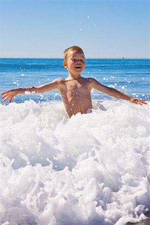 Child plkaying in the sea Stock Photo - Budget Royalty-Free & Subscription, Code: 400-04993065