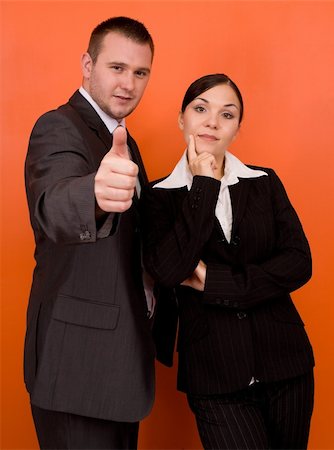 simsearch:6109-06002803,k - businesswoman and businessman in team standing on orange background Stock Photo - Budget Royalty-Free & Subscription, Code: 400-04993200