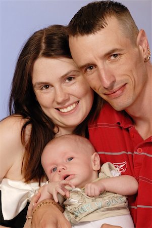 simsearch:400-04633809,k - mother, father and young baby boy posing for camera Photographie de stock - Aubaine LD & Abonnement, Code: 400-04993366