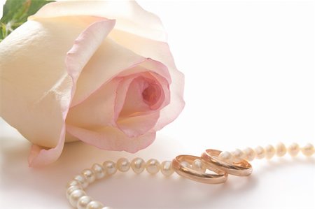simsearch:400-05361582,k - Wedding rings, pearl beads and rose over white, isolated, with clipping path Stock Photo - Budget Royalty-Free & Subscription, Code: 400-04993832
