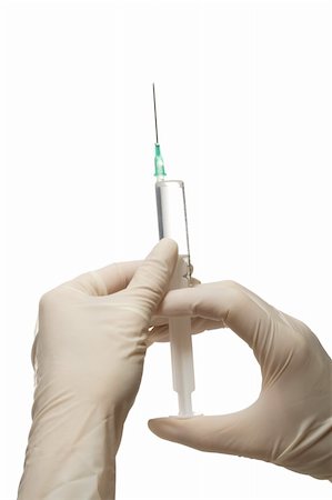 simsearch:400-07919695,k - Syringe in hand,getting ready for injection,isolated, on white background Fotografie stock - Microstock e Abbonamento, Codice: 400-04993841