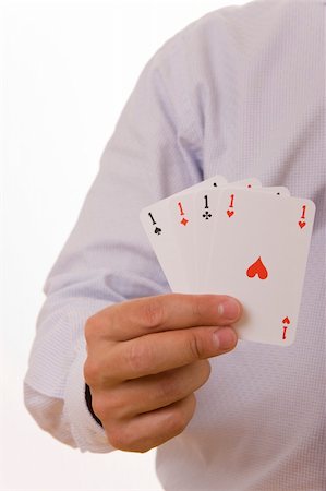 simsearch:400-04651363,k - A busiines man holding four playing cards with aces Photographie de stock - Aubaine LD & Abonnement, Code: 400-05004451
