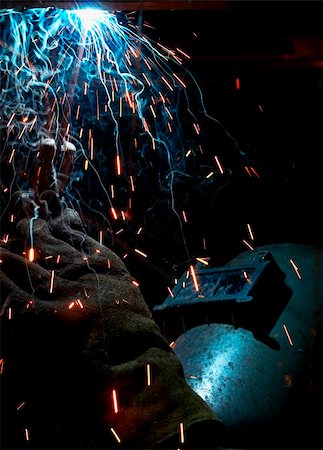 a picture of a welder working at night Stock Photo - Budget Royalty-Free & Subscription, Code: 400-05004464