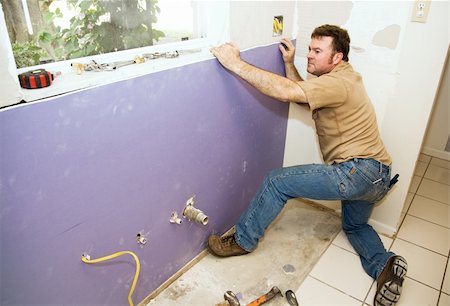 drywall - Contractor installing a large piece of drywall during a kitchen remodel. Stock Photo - Budget Royalty-Free & Subscription, Code: 400-05005006