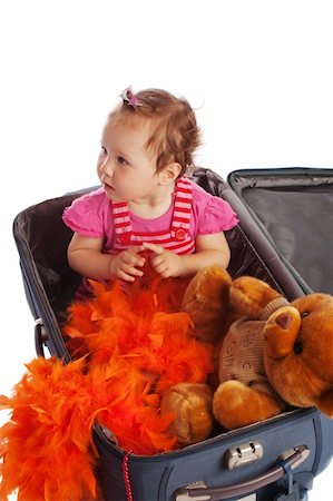 Toddler and teddy bear sitting in a suitcase, isolated Stock Photo - Budget Royalty-Free & Subscription, Code: 400-05005396