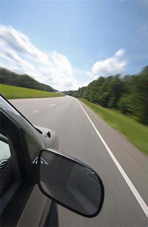 road landscape - Vehicle, with large rear view mirror, speeds down a country road Photographie de stock - Aubaine LD & Abonnement, Code: 400-05005477