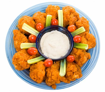 fried chicken plate - Delicious buffalo chicken wings with ranch dressing, celery, and grape tomatoes.  Isolated on white with clipping path Stock Photo - Budget Royalty-Free & Subscription, Code: 400-05006250