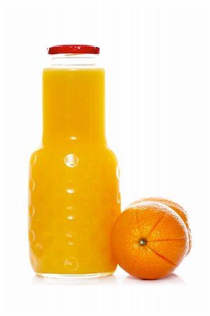 simsearch:400-03950882,k - Orange juice bottle reflected on white background. Shallow depth of field Stockbilder - Microstock & Abonnement, Bildnummer: 400-05006894